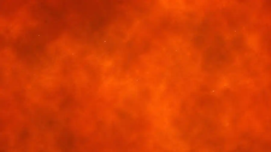Microscope view with microplastic particles on a warmer, orange background